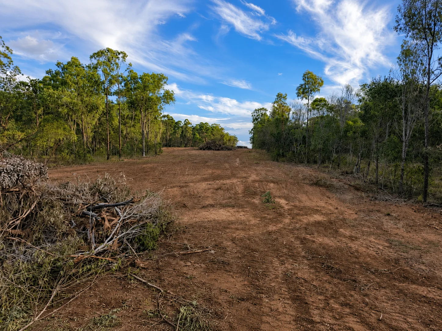 Volvo L150H wheel loader stick raking on a rural Queensland property.